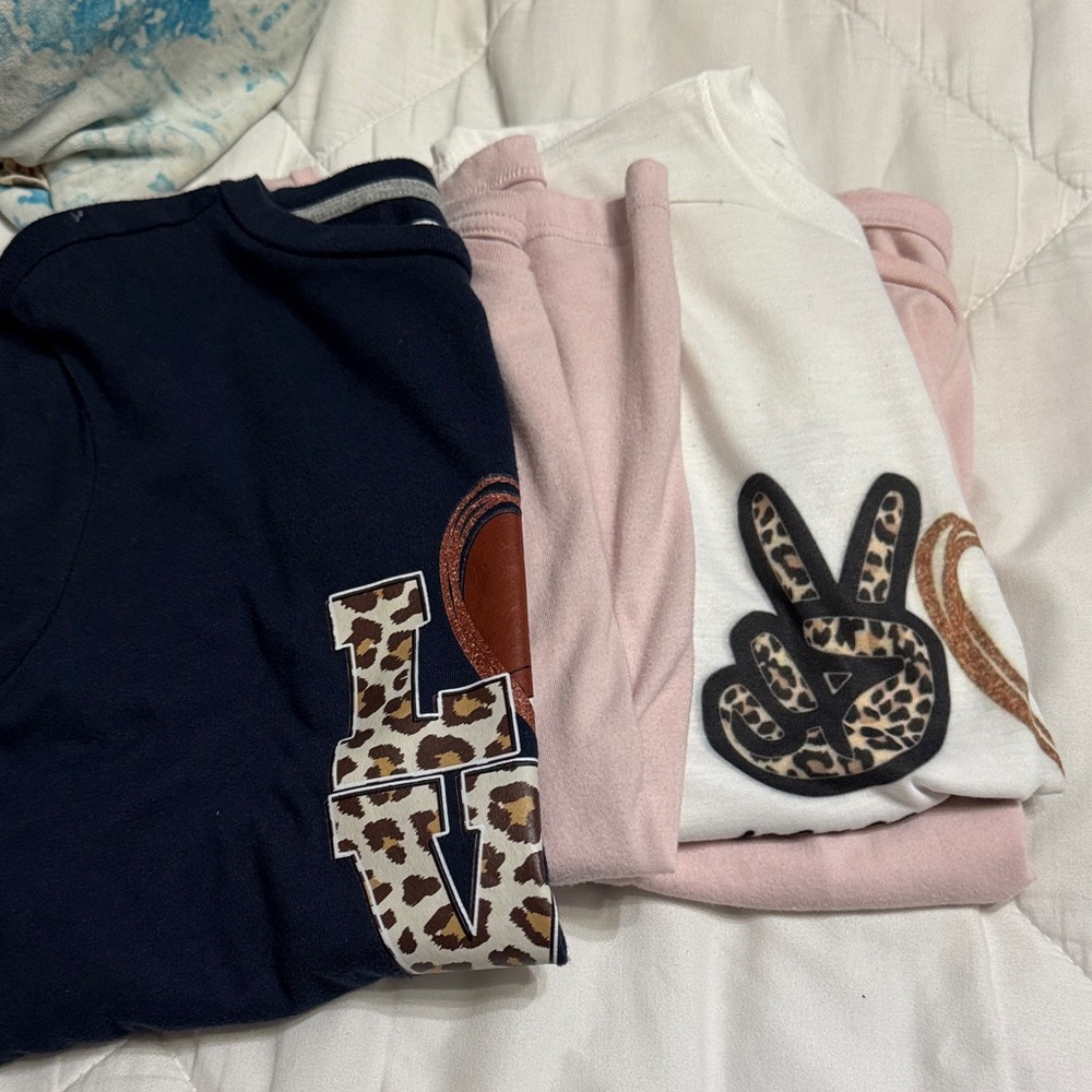 Set of Pink, White, and blue T-Shirts